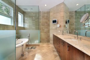 Modern master bath in luxury home with glass shower