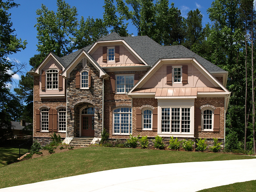 Large home with many windows of varying sizes