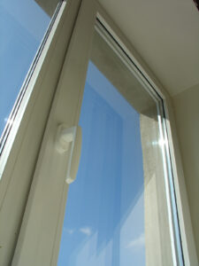 Brand-new clean window with a view of a blue sky