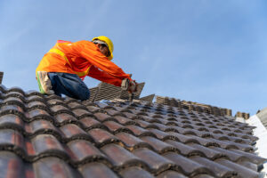 Worker installing a new roof on a home
